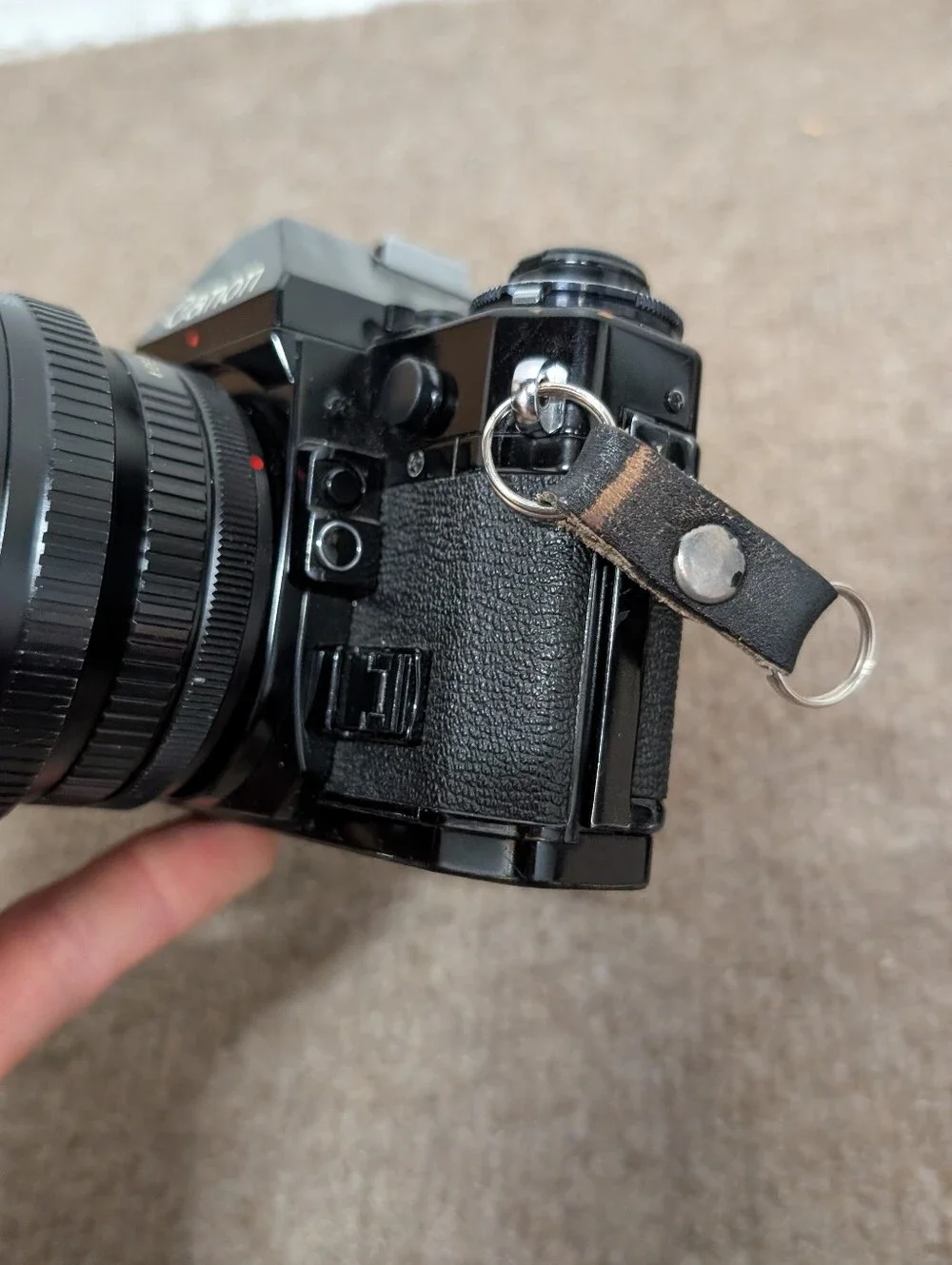 Vintage Canon A-1 Black SLR Camera with Black Lens and Black Flash